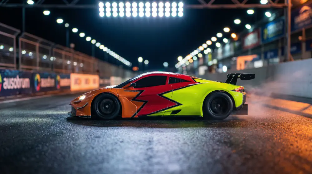 1/28 on-road RC car at speed on a night circuit
